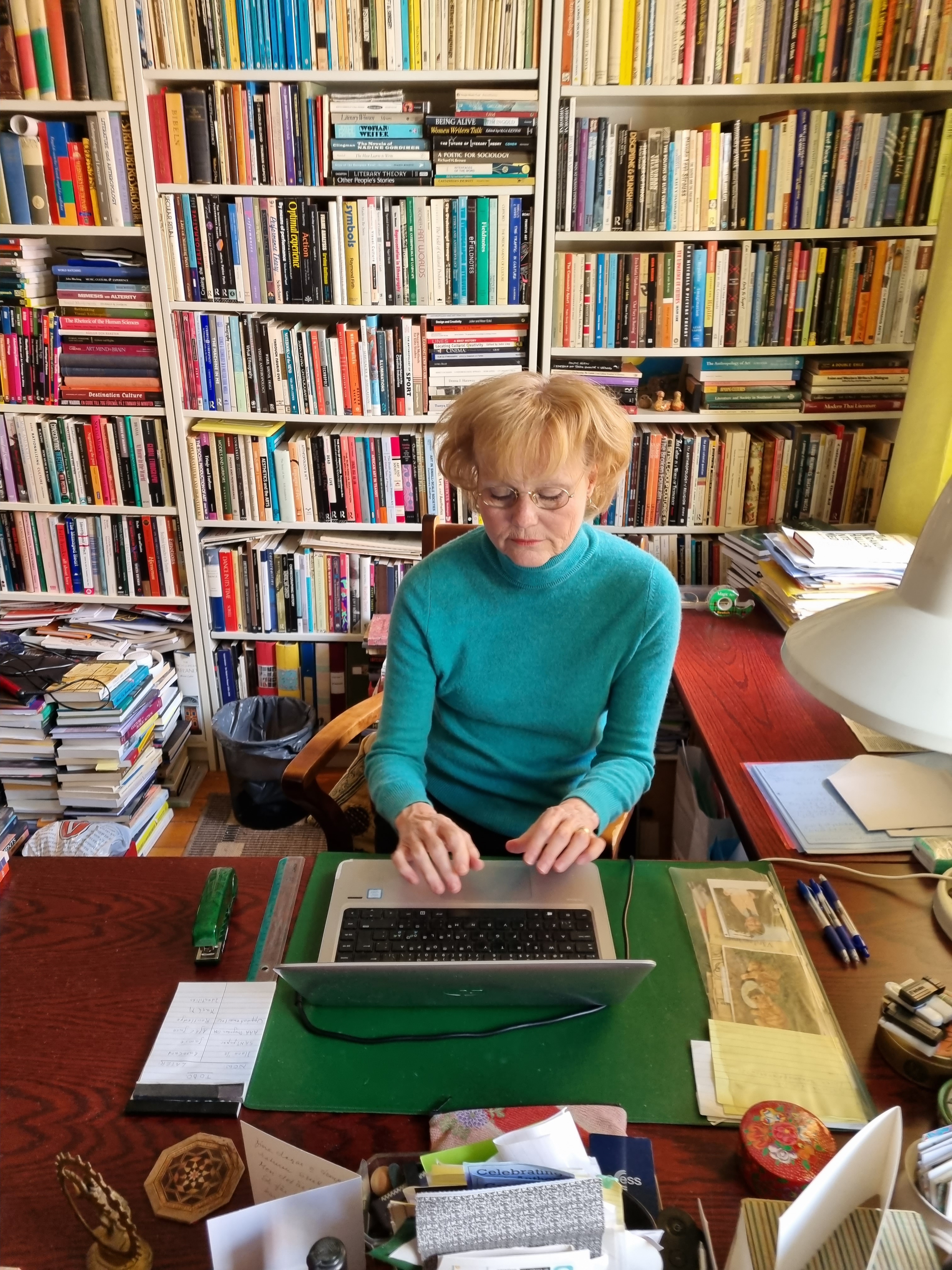 Helena happily writing away in her home study